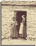Woman knitting in doorway